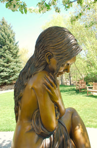 Solitaire life size figurative bronze sculpture by J. Anne Butler