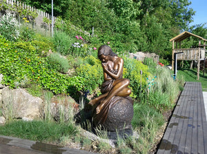 Solitaire life size figurative bronze sculpture by J. Anne Butler